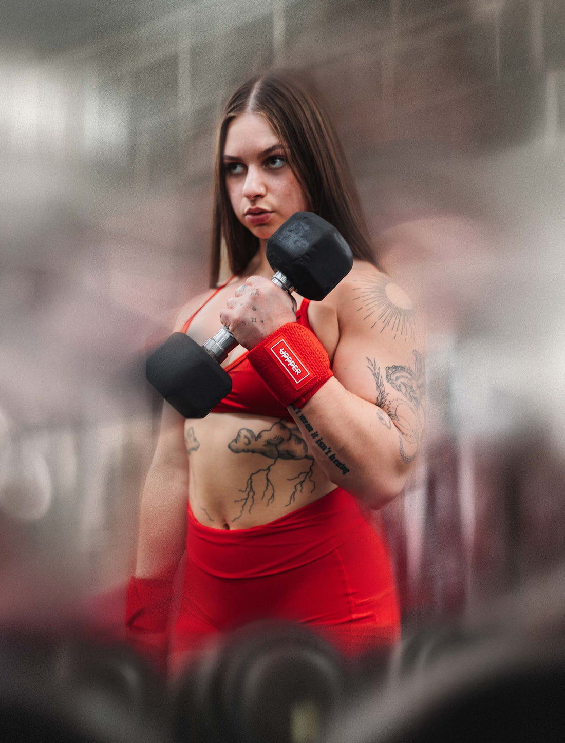 woman doing bicep curls with UPPPER wrist wraps