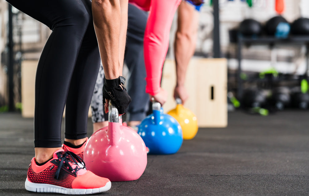 people doing kettlebell exercise